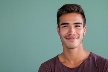 Obraz premium A close up portrait of a young man with a subtle smile