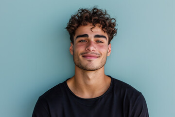 Obraz premium A close up portrait of a young man with a subtle smile