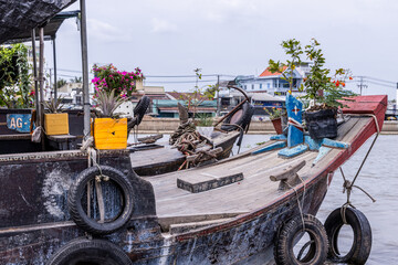 Photo of the front of some of the boats at the floating market in the mekong delta in Vietnam.