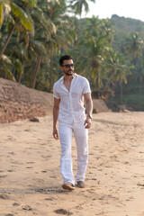 man at the beach in white clothes