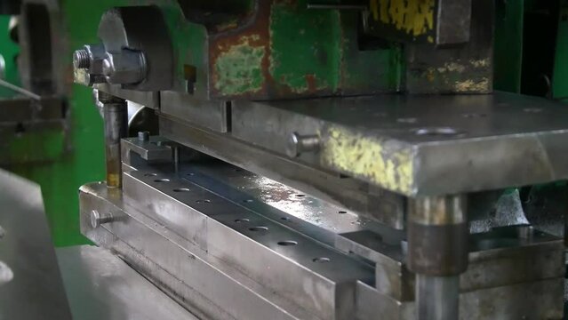 Factory hydraulic press. Stamping of sheet steel parts on a hydraulic press. Stamping on the press. 
