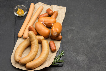 Sausages of different varieties on paper