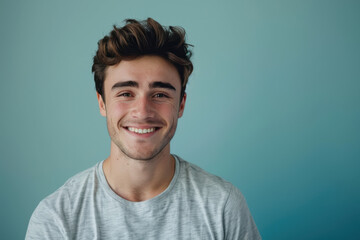 Obraz premium A close up portrait of a young man with a subtle smile