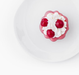 Top view of raspberry dessert on white plate