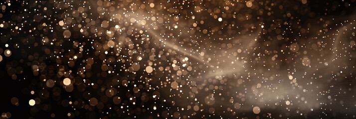 Background of white and yellow sequins on a black background. Gold dust light sparkle luxury glow...