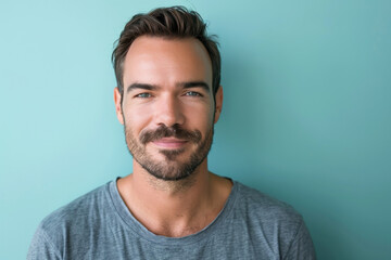 Fototapeta premium A close up portrait of a young man with a subtle smile