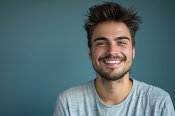 Obraz premium A close up portrait of a young man with a subtle smile