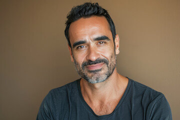 Fototapeta premium A close up portrait of a young man with a subtle smile