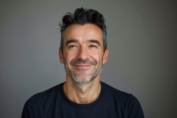 Obraz premium A close up portrait of a young man with a subtle smile