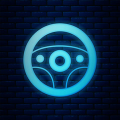 Glowing neon Steering wheel icon isolated on brick wall background. Car wheel icon. Vector