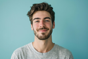 Obraz premium A close up portrait of a young man with a subtle smile