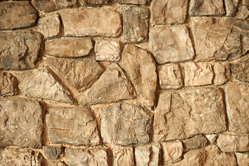 Textured Sandstone Wall Background - Natural Stone Surface Detail