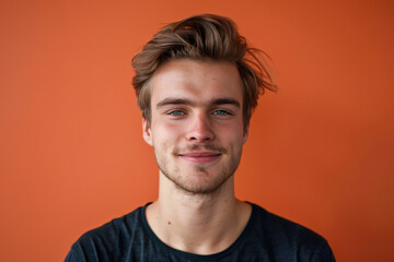 Fototapeta premium A close up portrait of a young man with a subtle smile