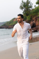 person running at the beach