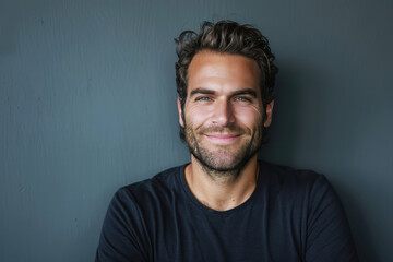 Fototapeta premium A close up portrait of a young man with a subtle smile