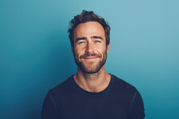 Fototapeta premium A close up portrait of a young man with a subtle smile