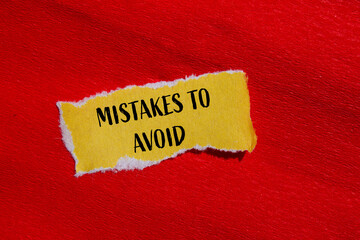 Mistakes to avoid message written on ripped yellow paper piece with red background. Conceptual...