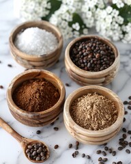 Ingredients for making homemade cosmetics arranged in bowls on a white marble surface with scattered coffee beans