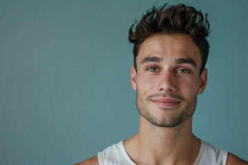 Fototapeta premium A close up portrait of a young man with a subtle smile