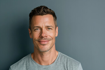 Fototapeta premium A close up portrait of a young man with a subtle smile