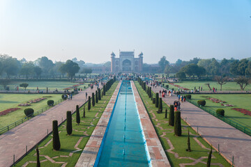 Fototapeta premium Experience the serene beauty of Taj Mahal in Agra, India at dusk, a majestic view to behold