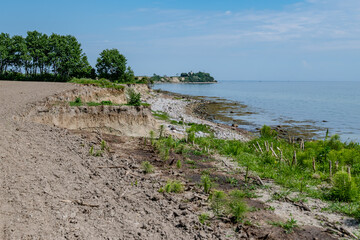 Beach at S&oslash;nderkobbel, Denmark with the view to lighthouse