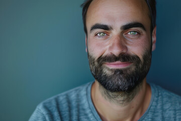 Obraz premium A close up portrait of a young man with a subtle smile