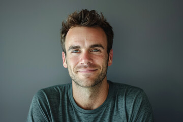 Obraz premium A close up portrait of a young man with a subtle smile