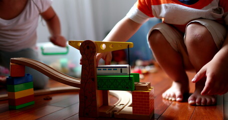 Children playing with toys, little sister and toddler