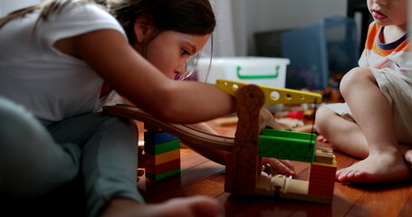 Children playing with toys, little sister and toddler