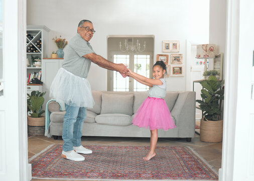 Portrait, girl and dancing with grandfather in family home for play, fun and dress up. Elderly man, kid and support or trust in lounge on weekend together for love, happiness and crazy or comedy