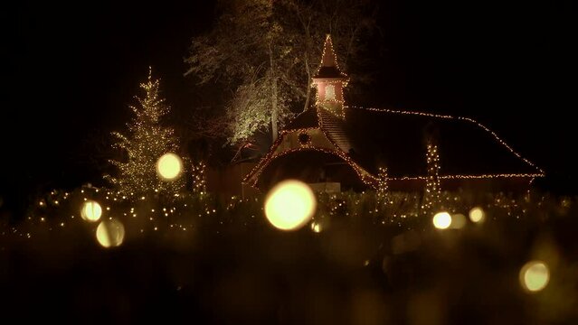 The church is stunning with Christmas lights at night, creating a magical atmosphere
