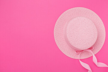 Pink hat on color background, top view. Summer concept