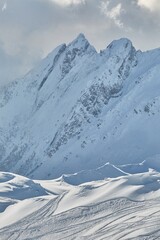 Fototapeta premium Winter high mountains in clouds