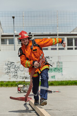 Firefighter Training and Preparing in Professional Gear for Job Hazards