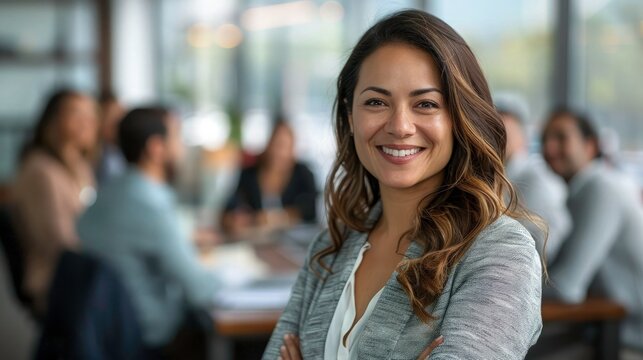 Portrait Happy business woman with group of business people working behind her in office. Teamwork and planning business idea.  