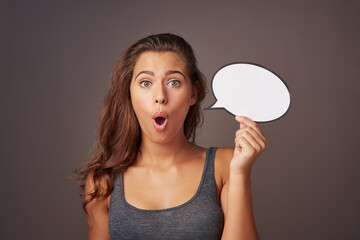 Speech bubble, surprise and portrait of woman in studio for omg news, opinion and feedback. Mockup space, social media and person with sign for information, announcement and emoji on dark background