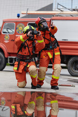 Firefighter Team Learning Thermal Camera Usage During Training Session