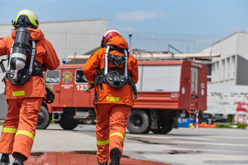 Firefighter Team Training with Various Tools in Professional Gear