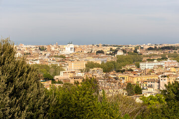 Obraz premium Rome, Italy - April 11, 2024: Rome, Italy - April 11, 2024: Aerial view of the city of Rome from one of the viewpoints on the hills in Rome, Italy