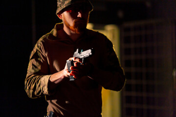 at a professional shooting range a military trainer reloading a pistol ready to shoot