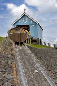 Resue boat on tracks. Wooden building Sea Rescue Service. City of Hindeloopen Friesland Netherlands. IJsselmeer. 