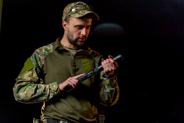 in a professional shooting range professional fighter assembles pistol introductory briefing