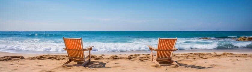Fototapeta premium Two lounger chair at calm beach with clear blue sky and ocean water