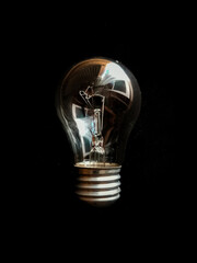 Ukraine electricity concept in a light bulb on a black background