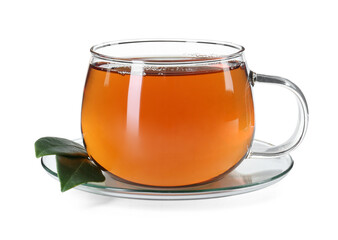 Aromatic tea in glass cup and green leaves isolated on white