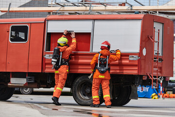 Firefighter Team Training with Various Tools in Professional Gear