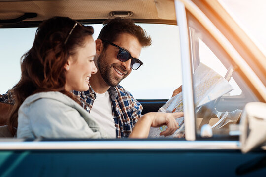 Road trip, couple and map in car for search, location navigation and destination for travel. Happy people, man and woman with paper for guidance, direction and instructions for adventure journey