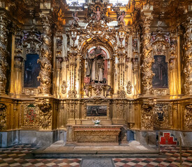detail view of a gilded altar piece in a side chapel of the Segovia Cathedral