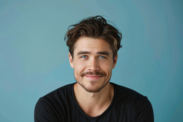 Fototapeta premium A close up portrait of a young man with a subtle smile